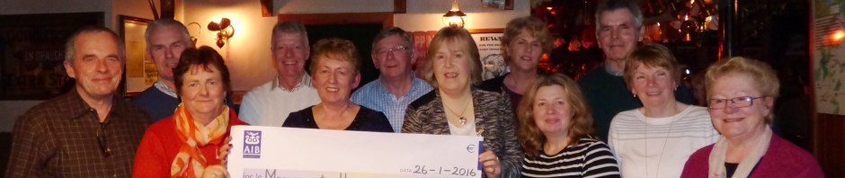 Members of Aghinagh Comhaltas making a presentation to Marymount Hospice charity